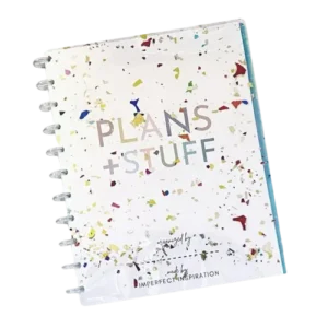 Plans + Stuff spiral planner by Imperfect Inspiration with a colorful confetti cover