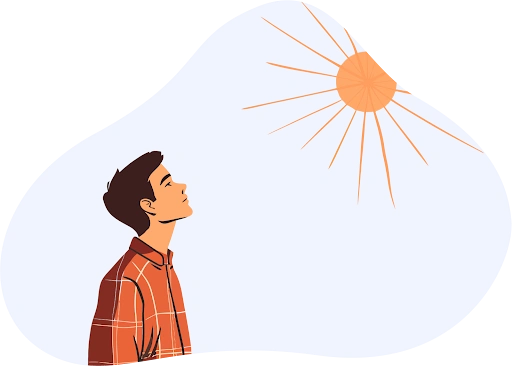 A man looking up at the sun in the morning sky