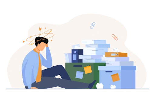 an overwhelmed man sitting on the floor surrounded by stacks of paperwork