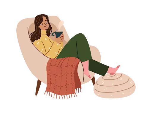 a woman relaxing in an armchair holding a cup of coffee